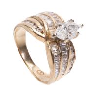Ladies Engagement Ring Boasting a .90 Carat Marquis Diamond with Accent Baguettes and Round Brilliant Cut Diamonds Totaling One