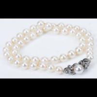 Elegant String of White Pearls with a 14K White Gold and Diamond Clasp