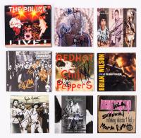 Eight (8) Autographed CD Covers By Acclaimed Musicians Including OASIS, The Police, Redf Hot Chili Peppers, Brian Wilson, Jane's
